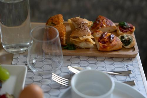a plate of food on a table with a plate of food at Domus Terravecchia in Agrigento