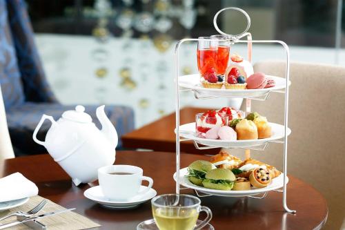 a three tiered tray of food on a table at The Westin Sendai in Sendai