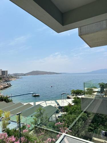 a view of the ocean from a house at Buzë Boutique Hotel in Sarandë