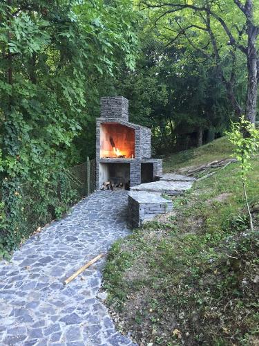 a stone oven with a fire in it on a path at Sweet Secret in Samobor