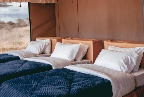 Ένα ή περισσότερα κρεβάτια σε δωμάτιο στο Pamoja Migration Camp