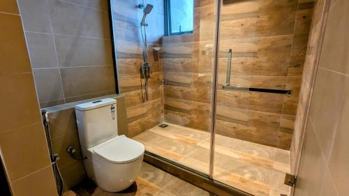 a bathroom with a toilet and a shower at Royal Lion Hotel - Kandy Road, Galagadara in Galagedara