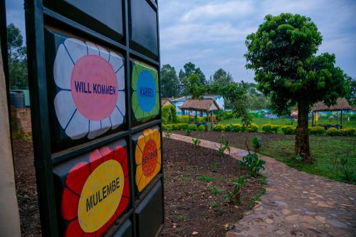 a building with colorful stickers on the side of it at Malava-K-Resort in Kakamega