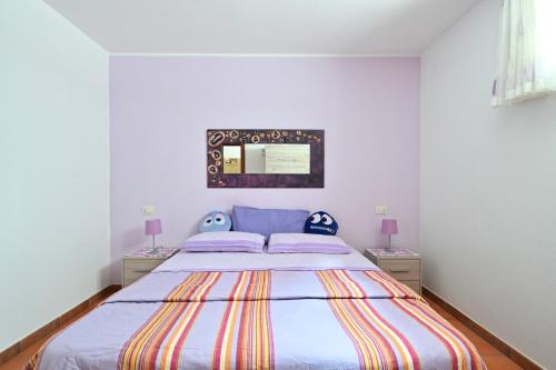 Ένα ή περισσότερα κρεβάτια σε δωμάτιο στο Casa Spaziosa