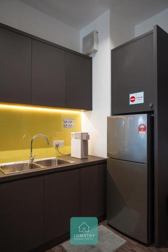 Kuchyň nebo kuchyňský kout v ubytování JOMSTAY Octagon Ipoh Suites