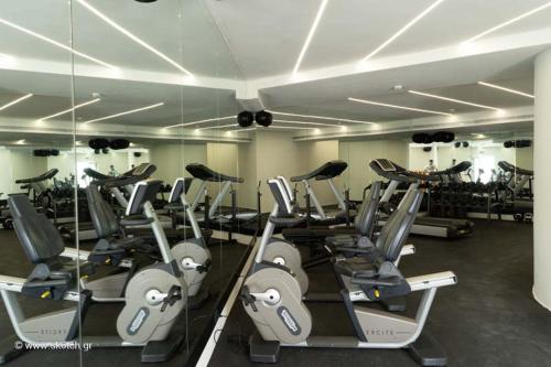 a gym with a bunch of treadmills at Νumi Boutique Hotel in Mýkonos City