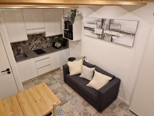 a small living room with a couch and a table at House Lisboa in Lisbon
