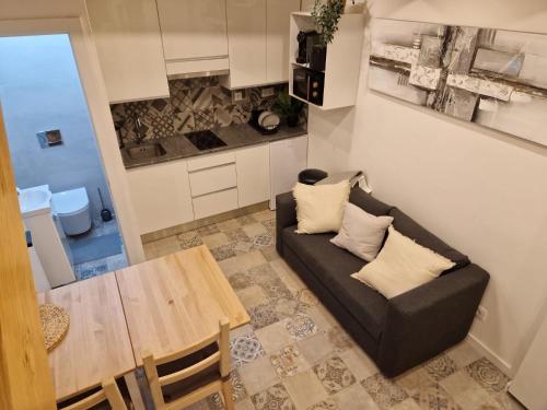 a living room with a couch and a table at House Lisboa in Lisbon