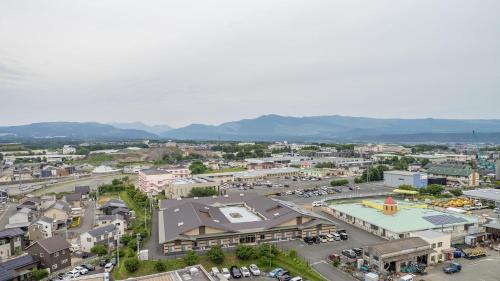 an overhead view of a town with a parking lot at Toyoko Inn Kumamoto Airport in Ozu