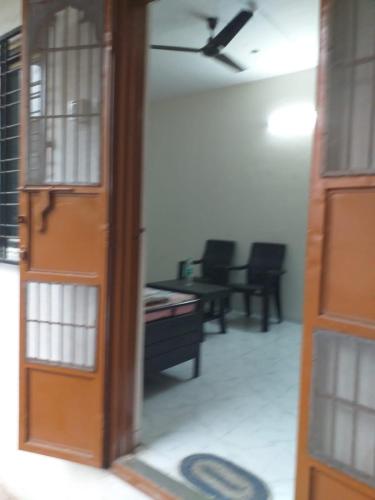 a view of a living room with a ceiling fan at 2 BHK ENTIRE ROW HOUSE Home stay in nashik in Nashik