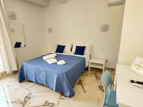 Postel nebo postele na pokoji v ubytování Residenza Gargano