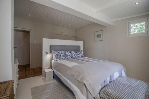 a bedroom with a large bed and a window at The Owl's Nest in McGregor