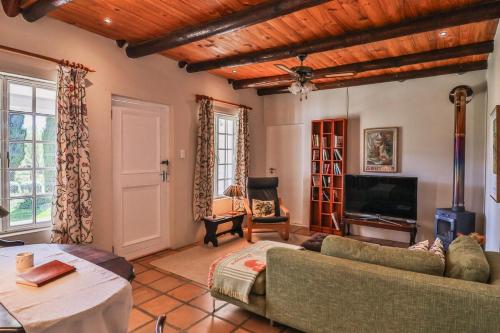 a living room with a couch and a tv at The Owl's Nest in McGregor