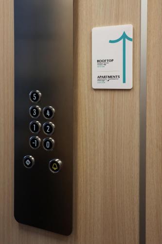 a door with a sign on it with a door knob at PALAZZO NOVA luxury apartments in Acerra