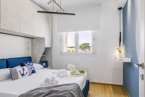 Postel nebo postele na pokoji v ubytování Italian Experience - Brezza Costa Conero & Beach