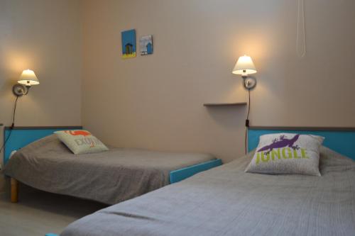 Ein Bett oder Betten in einem Zimmer der Unterkunft Atlantic Hôtel