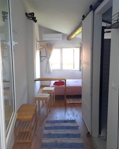 a small room with a bed and a table at Una sosta a Buti in Buti