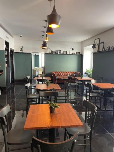 a dining room with wooden tables and chairs at Hotel Taormina in Rome