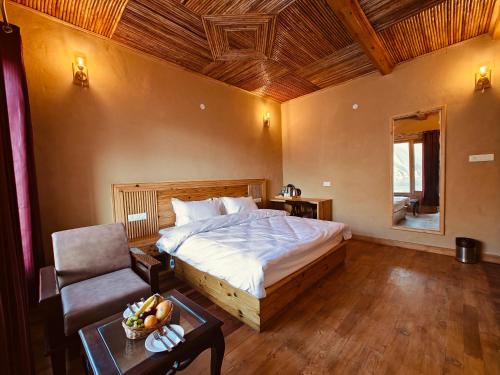 Postel nebo postele na pokoji v ubytování Hotel Rongtong - Kaza