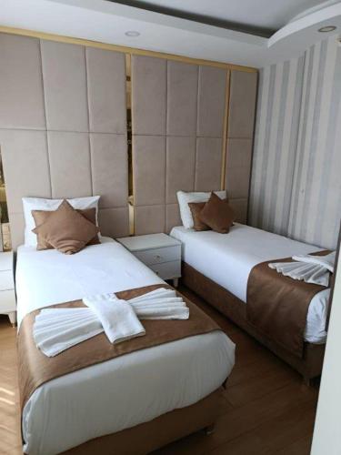 a hotel room with two beds in a room at Burj Al Istanbul in Istanbul