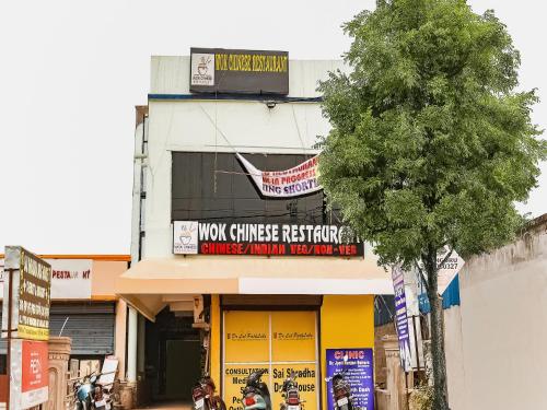 a building with a sign for a chinese restaurant at Hotel O S&h Residency Bahadalpur Railway Station in Khandagiri