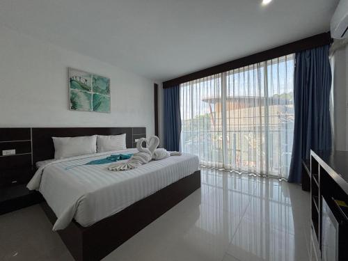Ένα ή περισσότερα κρεβάτια σε δωμάτιο στο Aqua Inn Ao Nang