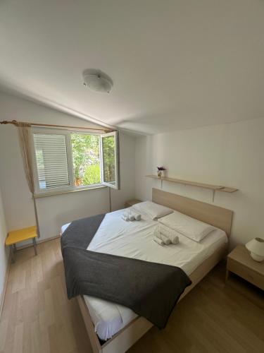 Posteľ alebo postele v izbe v ubytovaní Apartments Lavanda