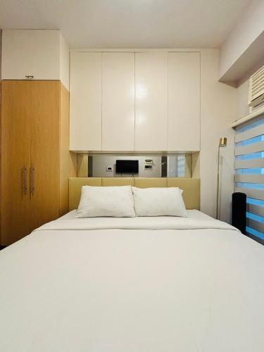 Ένα ή περισσότερα κρεβάτια σε δωμάτιο στο Staycation Champ Close to Your Heart