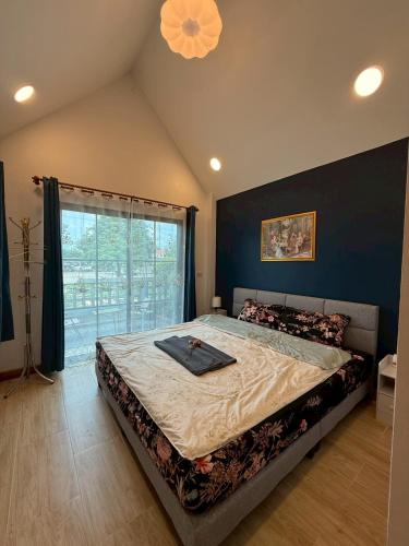 Postel nebo postele na pokoji v ubytování ลอยละล่อง รีสอร์ท Loy La Long Resort