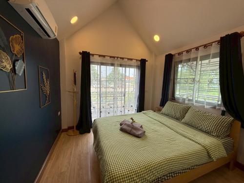 Postel nebo postele na pokoji v ubytování ลอยละล่อง รีสอร์ท Loy La Long Resort