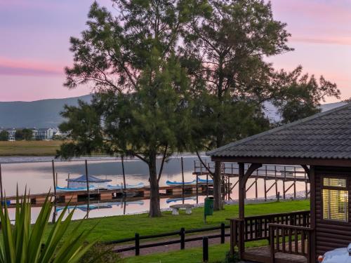 a view of a marina with boats in the water at Knysna River Club Getaways - Luxury waterfront chalets in Knysna
