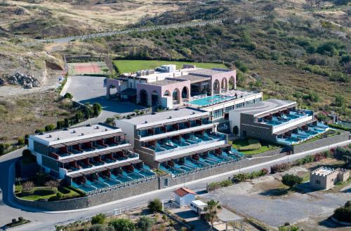 an aerial view of a building with a swimming pool at Boutique 5 Hotel & Spa - Adults Only in Kiotari