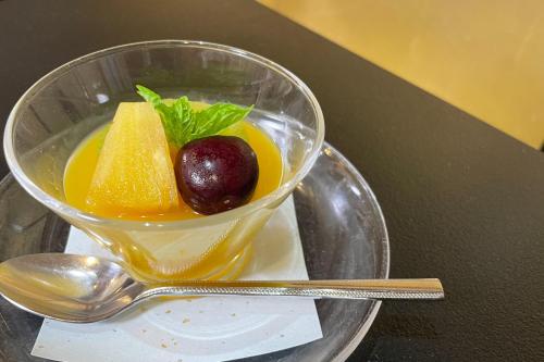 a glass bowl of fruit and a fruitasteryasteryasteryasteryasteryasteryasteryastery at 高野山 宿坊 総持院 -Koyasan Shukubo Sojiin- in Koyasan