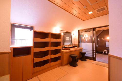 a bathroom with wooden shelves and a window at 高野山 宿坊 総持院 -Koyasan Shukubo Sojiin- in Koyasan