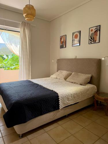 Postel nebo postele na pokoji v ubytování Nefeli Beach Home
