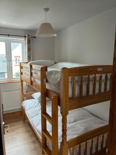 Postel nebo postele na pokoji v ubytování Old Mart Lodge