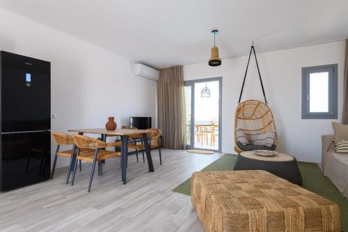 a living room with a table and a couch at Villa Evi in Kastraki
