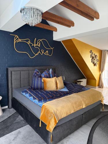a bedroom with a bed with a blue wall at Starlight in Hamburg
