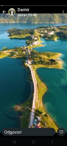 an aerial view of an island in the water at Auto Camping Grubeša in Dronjići