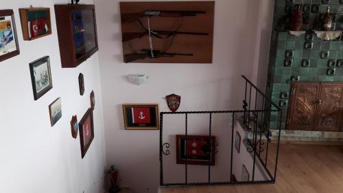 a hallway with a staircase with pictures on the wall at Dardanelles1915 in Canakkale