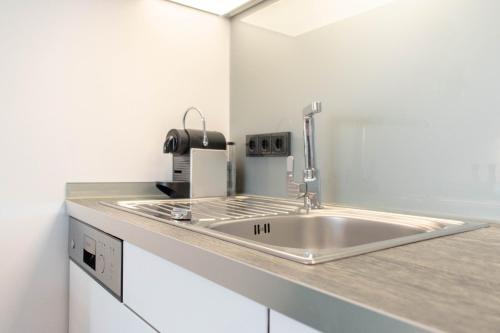 Kuchyň nebo kuchyňský kout v ubytování Ferienwohnung 54 Grad Nord App 8