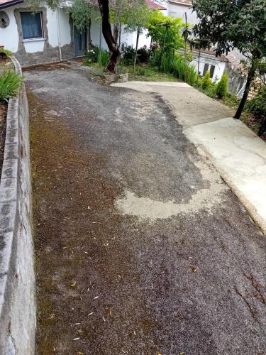 an empty driveway in front of a house at Cuore Verde del Cilento in Laureana Cilento