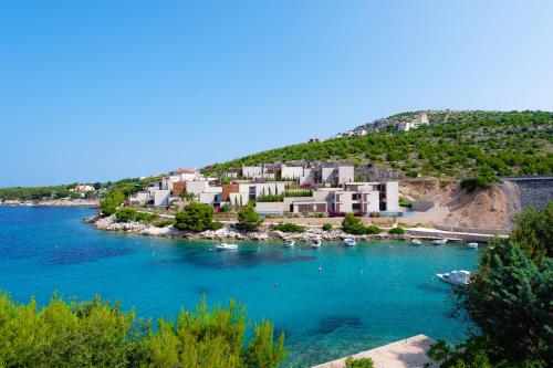 a resort on the shore of a body of water at Villa Lavanda in Primošten