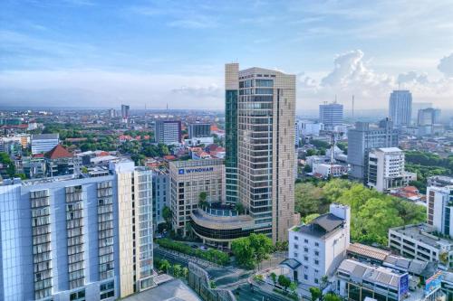 an aerial view of a city with tall buildings at Wyndham Surabaya in Surabaya
