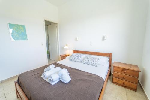 Postel nebo postele na pokoji v ubytování Villa Calliope Kalamaki