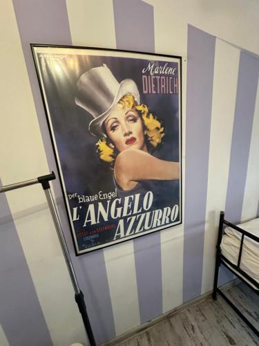 a large movie poster hanging on a wall at AB Hostel in Warsaw