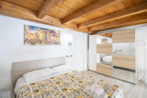 Ένα ή περισσότερα κρεβάτια σε δωμάτιο στο Appartamento Signorini Bolognaholidayhome - Parcheggio e Giardino privato - Holiday House Bologna Garden Parking