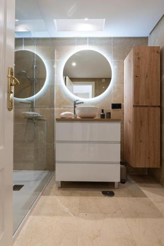 a bathroom with a sink and a mirror at 327 marina duquesa in Manilva