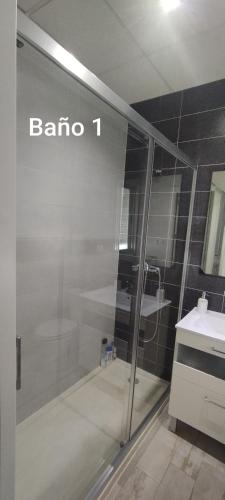 a bathroom with a shower and a sink at Los Álamos in Mérida