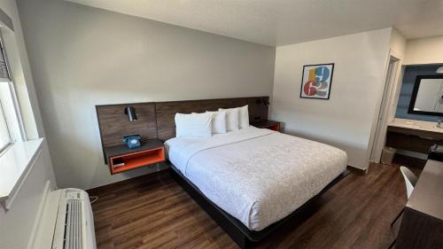 a hotel room with a large bed and a window at Motel 6 Galveston, TX Seawall in Galveston